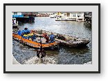 Buy Print of Garbage picker and barge grabbing bikes from the canal