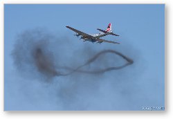 License: B-17 Flying Fortress over a smoke ring from bombing run