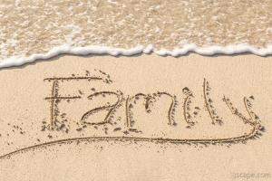 Family Writing in Sand