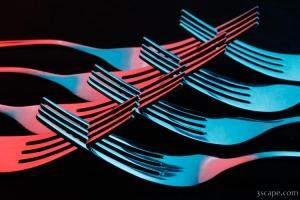 Red and Blue Intertwined Forks Abstract