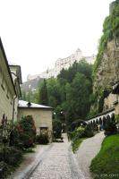 Cobblestone street with Hohensalzburg Fortress