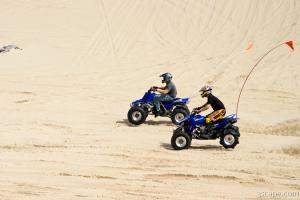 Quads riding in dunes