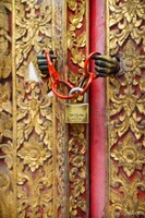 Hands holding the door closed