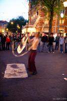 Street performer showing off fire ropes