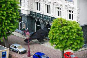 Previous: Giant crow attacking a store front