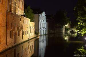 Next: Lit buildings along the River Dijver