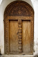 These ornately carved wood doors show the wealth of home owners
