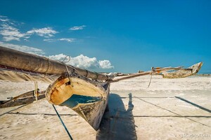 This boat rested on the sand as the tide went out