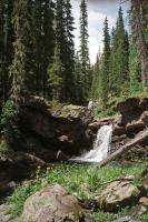 Waterfall and cold mountain pool