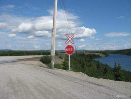Next: One of many railroad crossings between Gagnon and Fire Lake