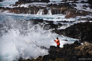 Fisherman and powerful surf near Honolua