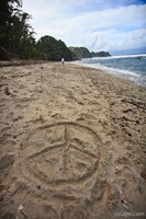 Peace sign in the sand