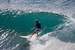 Next Image: Surfer taking a wave near Honolua