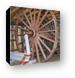 An old logging wheel and sliegh Canvas Print