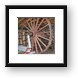 An old logging wheel and sliegh Framed Print