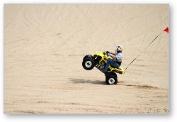 License: Quad ATV doing a wheelie