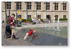 License: Little boy playing in the fountain