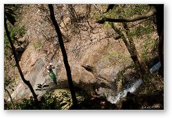 License: Rappelling down the cable over a waterfall