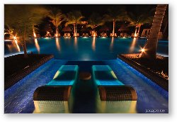 License: Night shot of the adult pool with sunken loungers