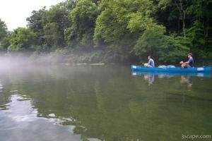 Paddling down the foggy river