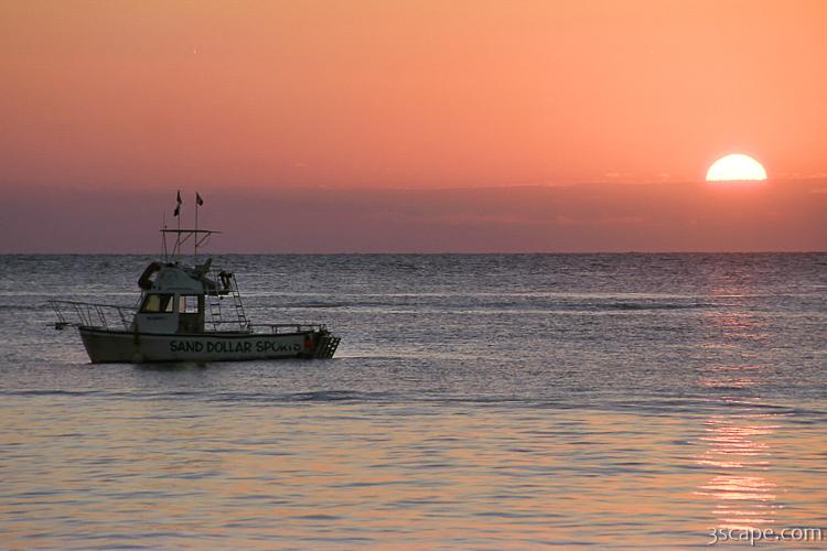 Sunset and dive boat