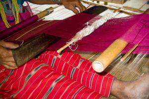 Karen tribe woman making a silk scarf