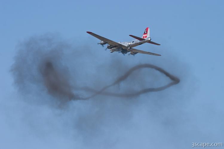 B-17 Flying Fortress over a smoke ring from bombing run
