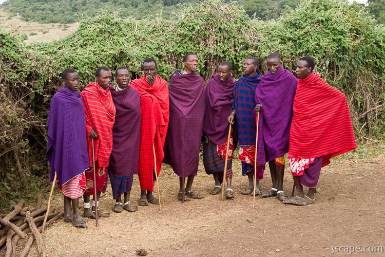 Group of Maasai men prepping for a welcome song and dance