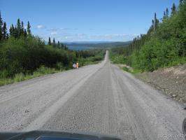 Endless gravel road with view of Manicouagan Reservoir