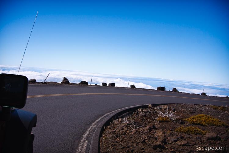 Road with no guard rail, high above the clouds