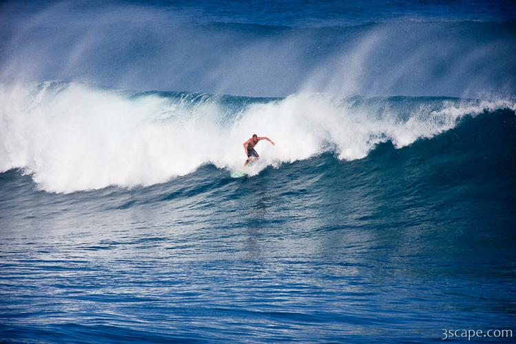 Surfer cutting a wave on Maui's north shore - Hookipa