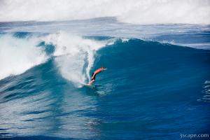 Surfer cutting a wave on Maui's north shore - Hookipa
