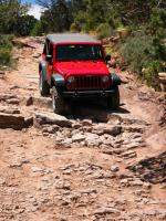 Jeep Rubicon taking some rock steps