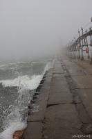 Pier in fog and waves