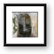 Stairs to tower built into rock Framed Print