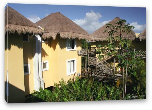 The huts at the Reef Club Resort Fine Art Canvas Print