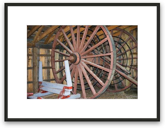 An old logging wheel and sliegh Framed Fine Art Print