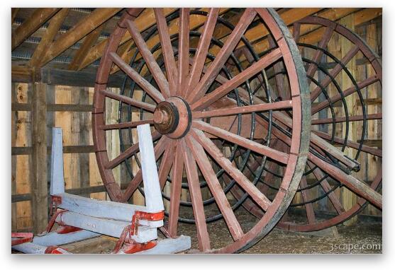 An old logging wheel and sliegh Fine Art Metal Print