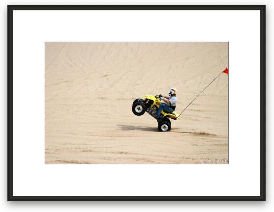 Quad ATV doing a wheelie Framed Fine Art Print
