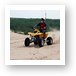 Quad ATV riding in dunes Art Print