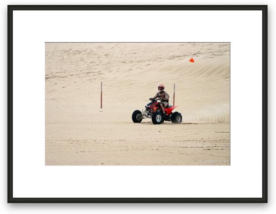 Quad ATV riding in dunes Framed Fine Art Print