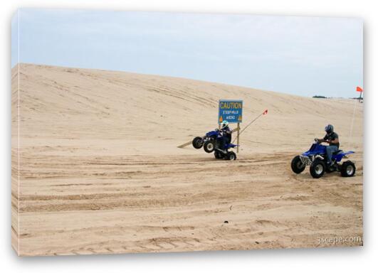 Quad ATV riding in dunes Fine Art Canvas Print
