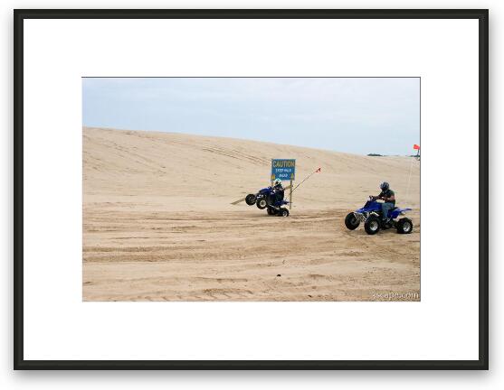Quad ATV riding in dunes Framed Fine Art Print