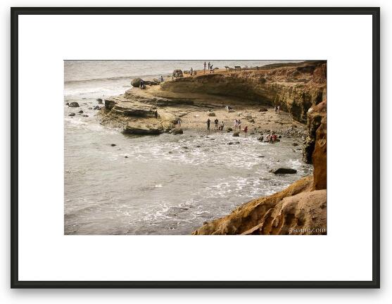 Small beach along the rocky shore Framed Fine Art Print