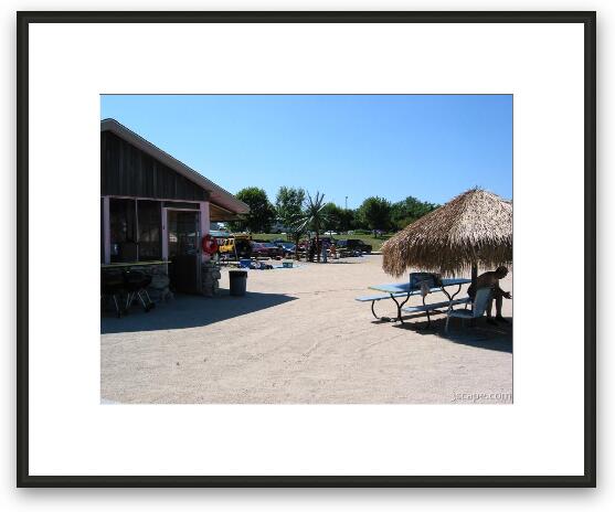 The building and Tiki huts Framed Fine Art Print
