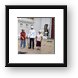 Tourists checking out a gate guard Framed Print