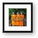 Three young Buddhist monks at a monastery in Chiang Mai, Thailand Framed Print