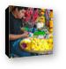 Street vendor making offerings for the temple Canvas Print