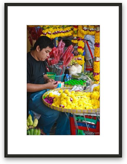 Street vendor making offerings for the temple Framed Fine Art Print