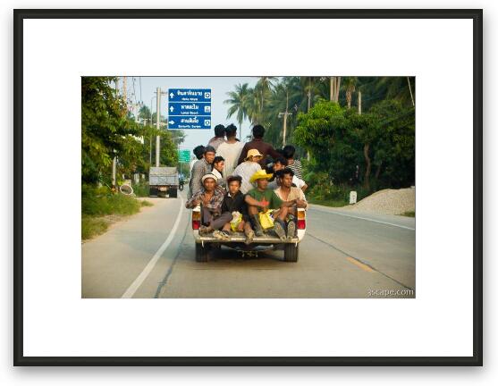 About 15 workers piled into the back of a pickup Framed Fine Art Print